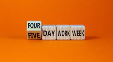 4 or 5 day work week symbol. Turned the cube and changed words ‘five day work week’ to ‘four day work week’. Beautiful orange background. Copy space. Business and 4 or 5 day work week concept.