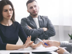 Deceived couple disputing about mortgage loan with realtor